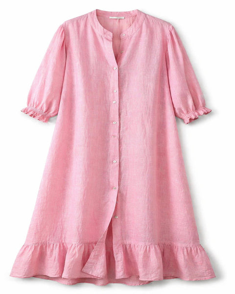 Vestido largo de lino rosa con botones frontales, mangas con volumen y volante en el bajo.