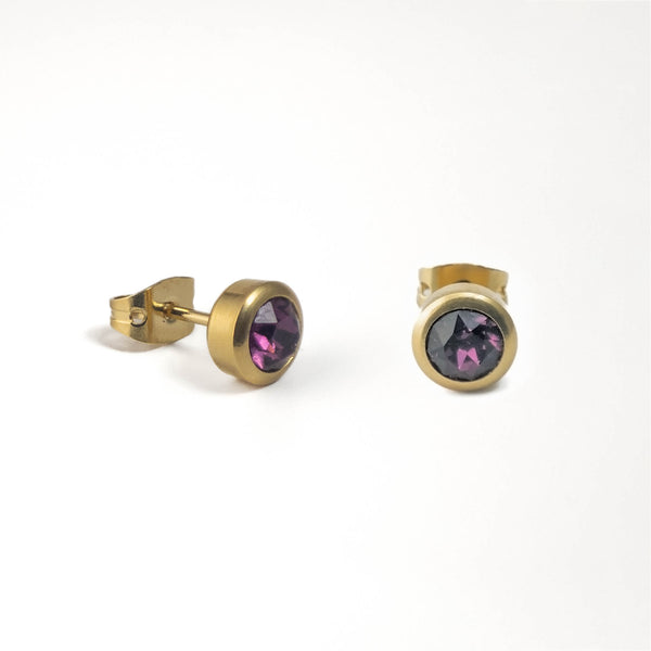 pendientes chapado en oro de presión  con un cristal de swarovski  morado